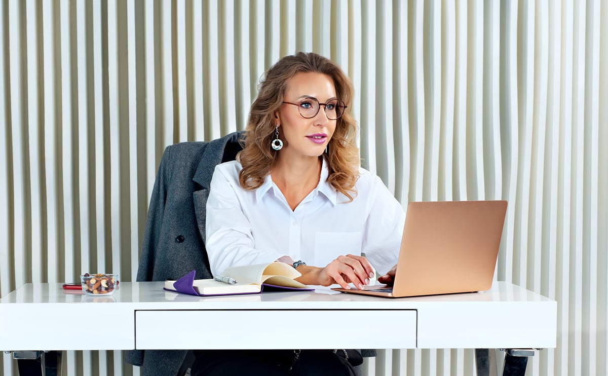 Businesswoman in his office. Financially independent successful young woman at work.