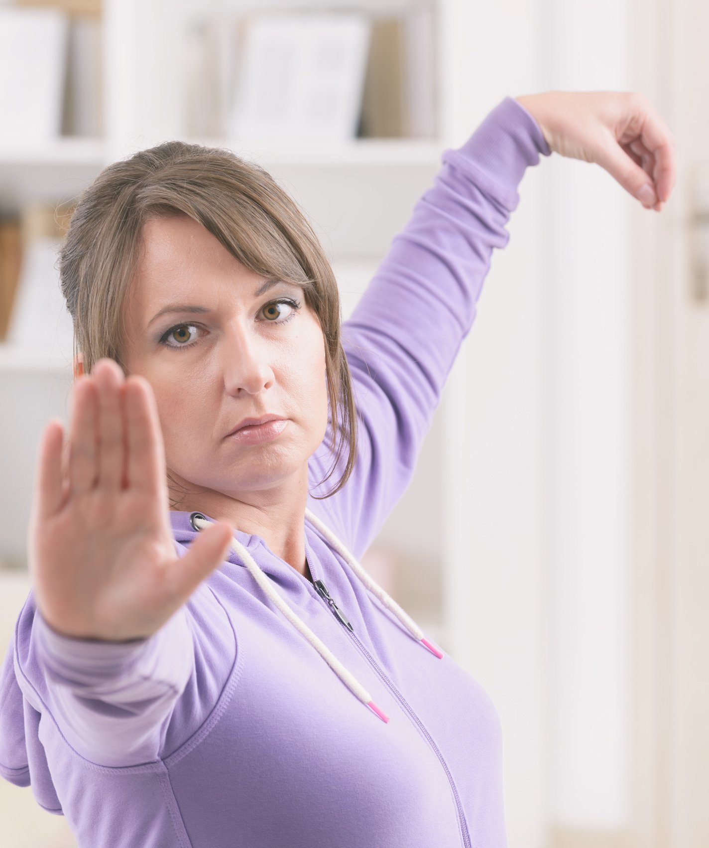 Woman doing qi gong tai chi exercise